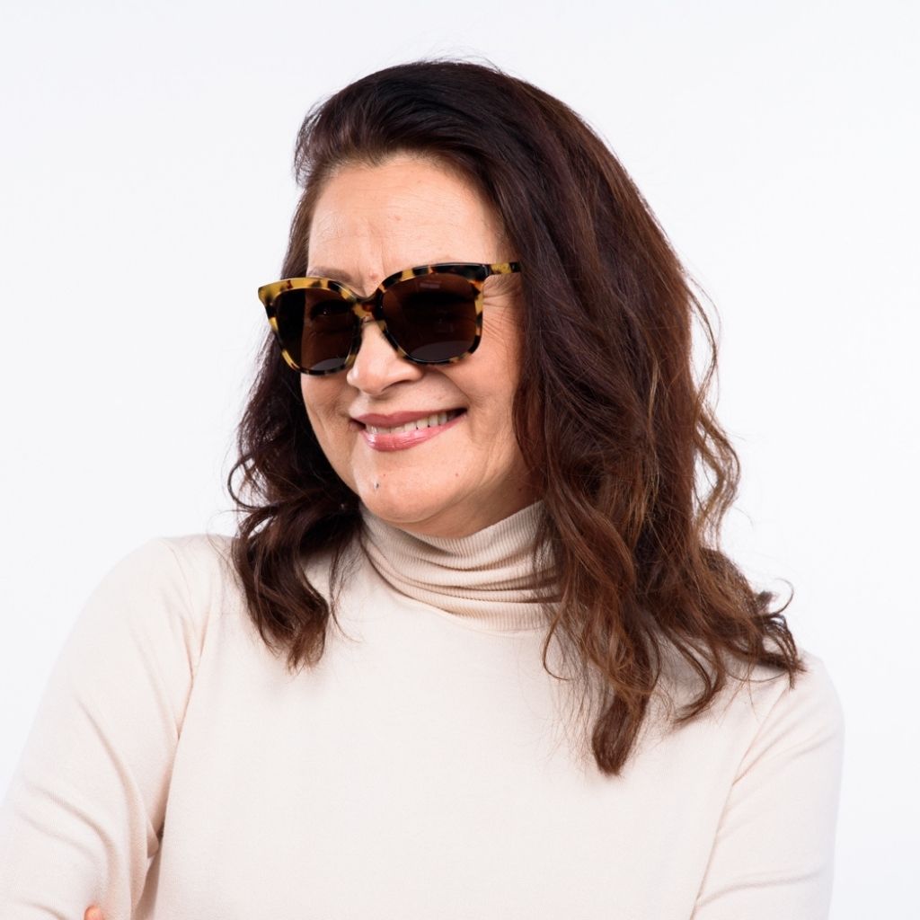 visible:Kanoe has a square face, low nose bridge, med face width, light skin with warm undertones:black #color_Lilikoi Tortoise with Polarized Tan Lens