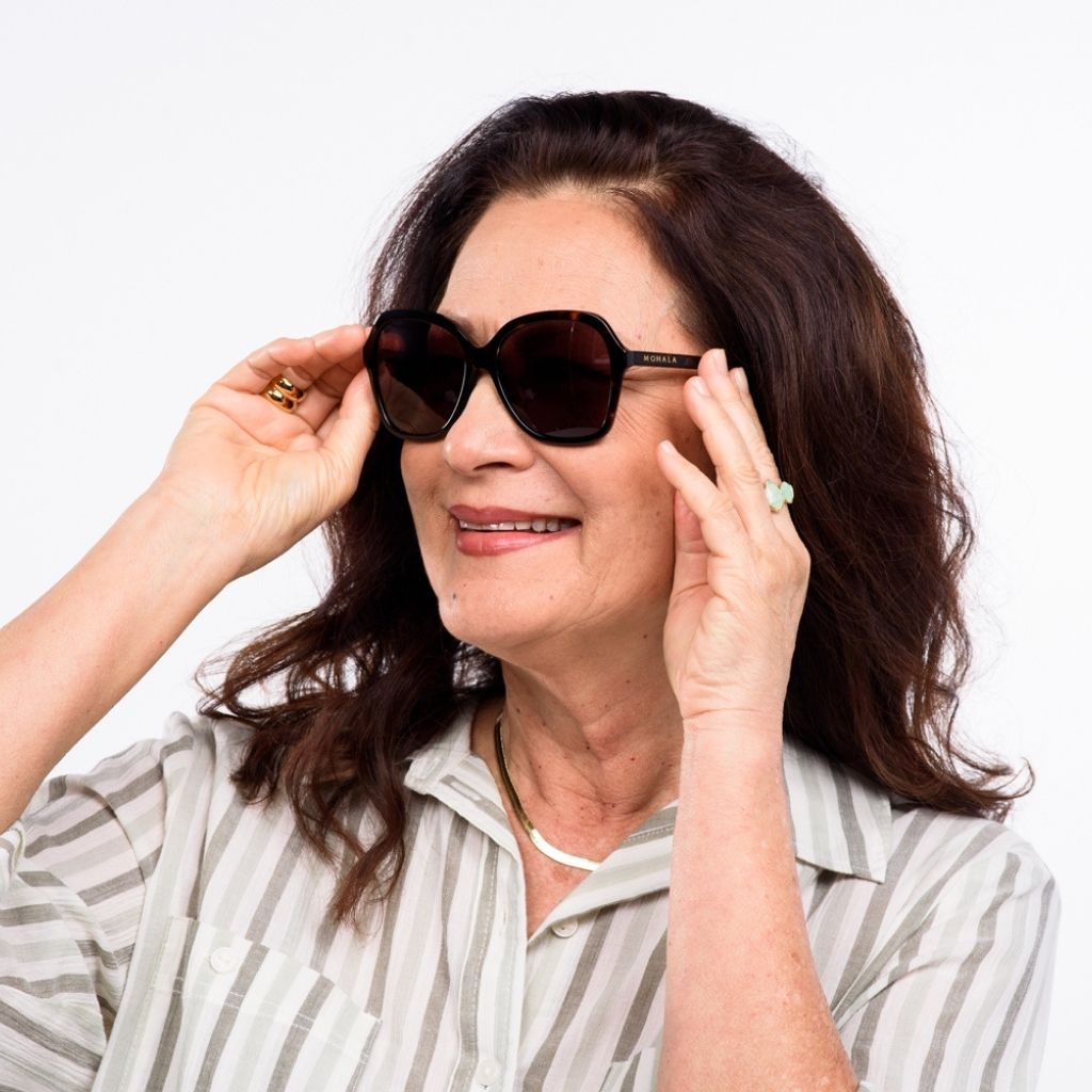 visible:Kanoe has a square face, low nose bridge, med face width, light skin with warm undertones:black #color_Kukui Tortoise with Polarized Tan Lenses
