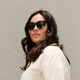 visible:Mel has round face shape, extra wide face width, med nose bridge:black #color_Kukui Tortoise with Polarized Tan Lenses