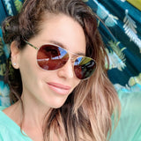 visible:Toccara has a heart face, tall nose bridge, narrow face width, med skin with cool undertones #color_Glossy Gold with Polarized Gray Lenses