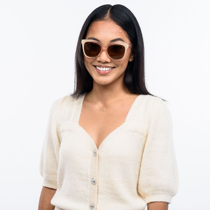 visible:Angeleyh has a square face shape, med face width, med skin tone with warm undertones:black #color_Pink-a-colada with Polarized Gold Mirrored Lenses